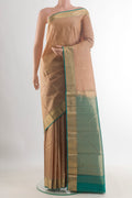 Pure Silk Beige Kanchipuram Saree with Jacquard With Zari Butta on the body and Zari Border.  displayed on a mannequin