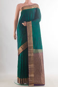 Pure Silk Teal Kanchipuram Saree with Jacquard design on the body and Zari Border.  displayed on a mannequin