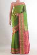 Pure Silk Green Kanchipuram Saree with Zari Butta on the body and Zari Border.  displayed on a mannequin