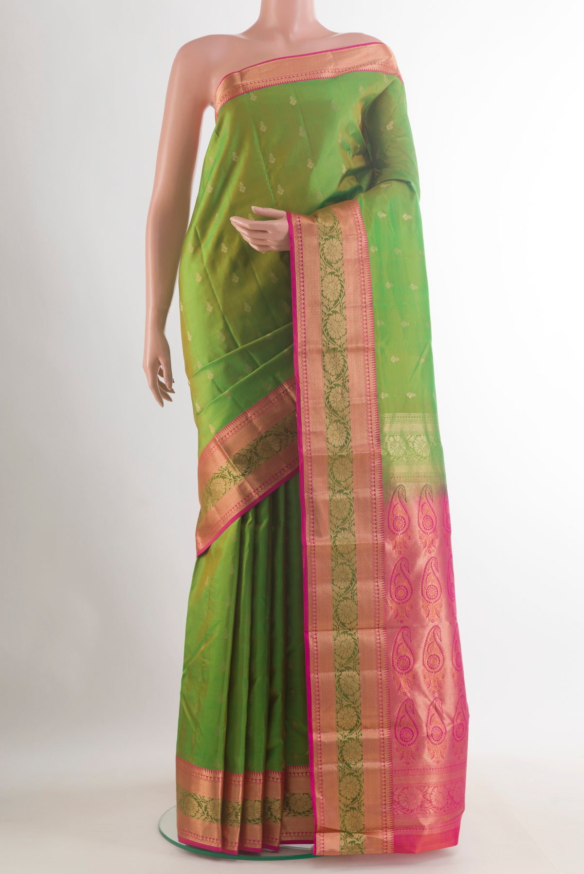 Pure Silk Green Kanchipuram Saree with Zari Butta on the body and Zari Border.  displayed on a mannequin