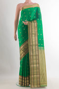 Pure Silk Green Kanchipuram Saree with Zari Butta on the body and Zari Border.  displayed on a mannequin