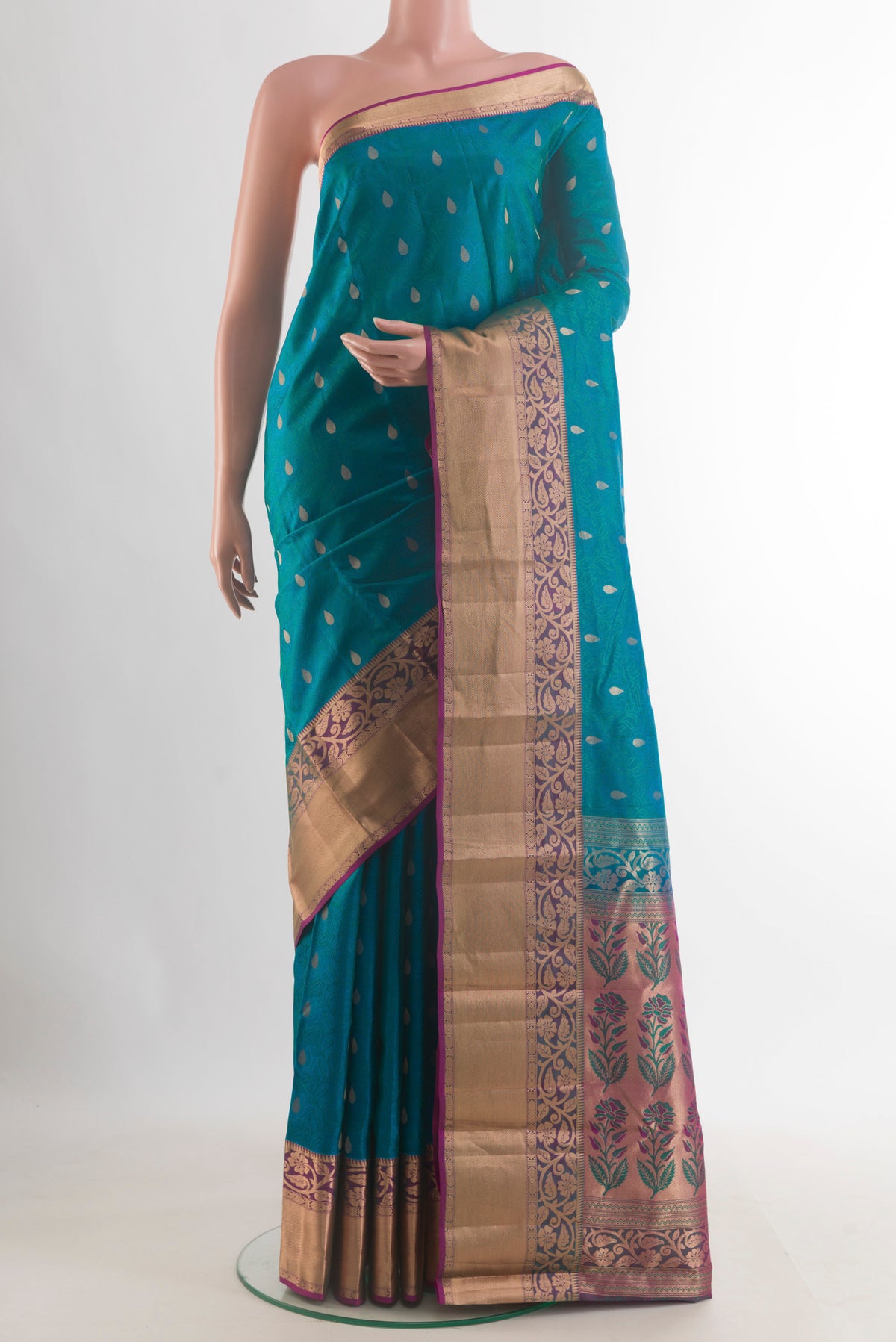 Pure Silk Blue Kanchipuram Saree with Jacquard With Zari Butta on the body and Zari Border.  displayed on a mannequin