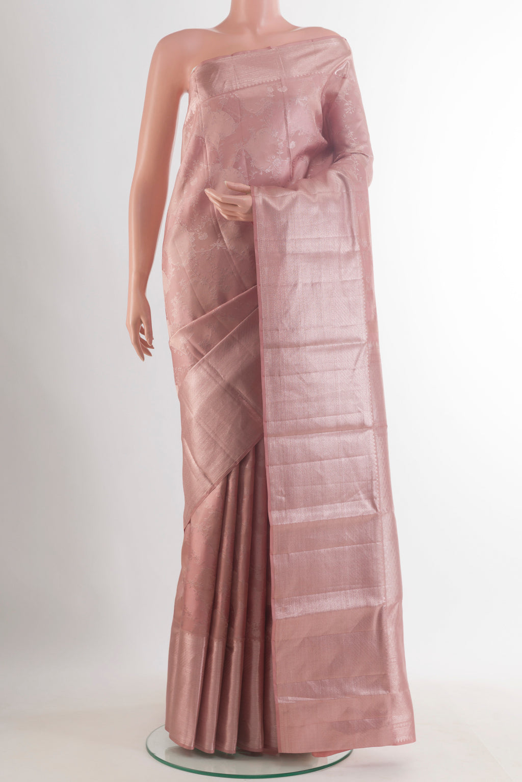 Pure Silk Rose Gold Kanchipuram Saree with Zari Brocade on the body and Zari Border.  displayed on a mannequin