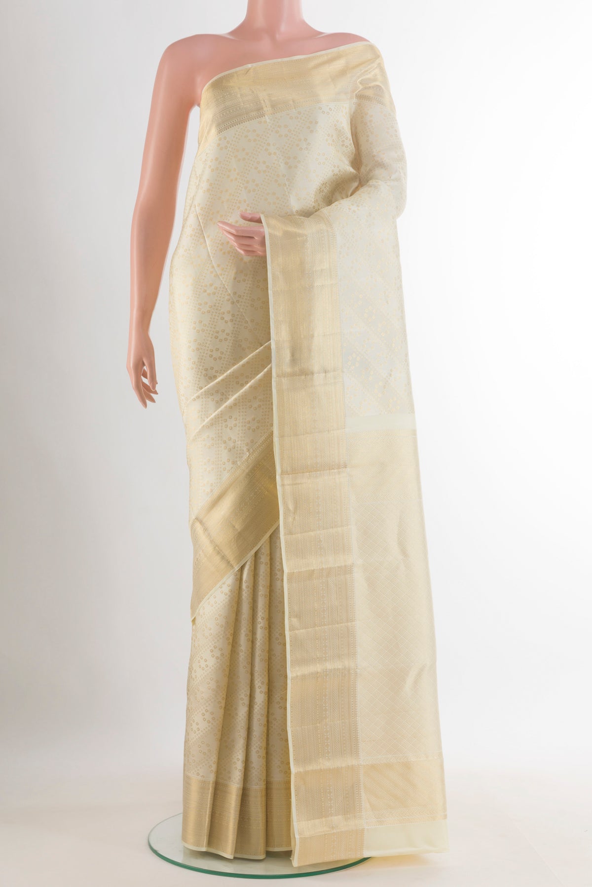 Pure Silk Off White Kanchipuram Saree with Zari Brocade on the body and Zari Border.  displayed on a mannequin