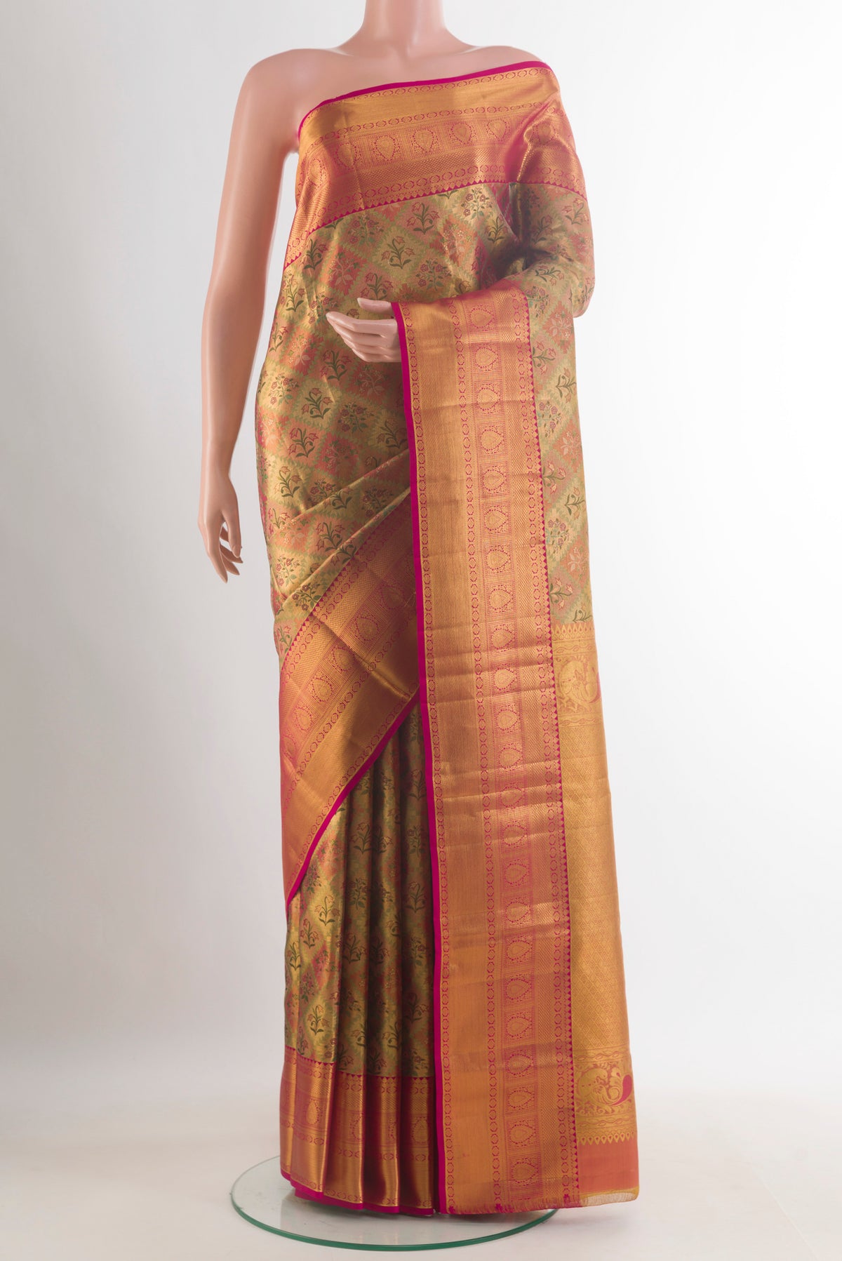 Golden Dual Tone Kanjivaram Tissue Saree with Zari Brocade on the body and Zari Border.  displayed on a mannequin