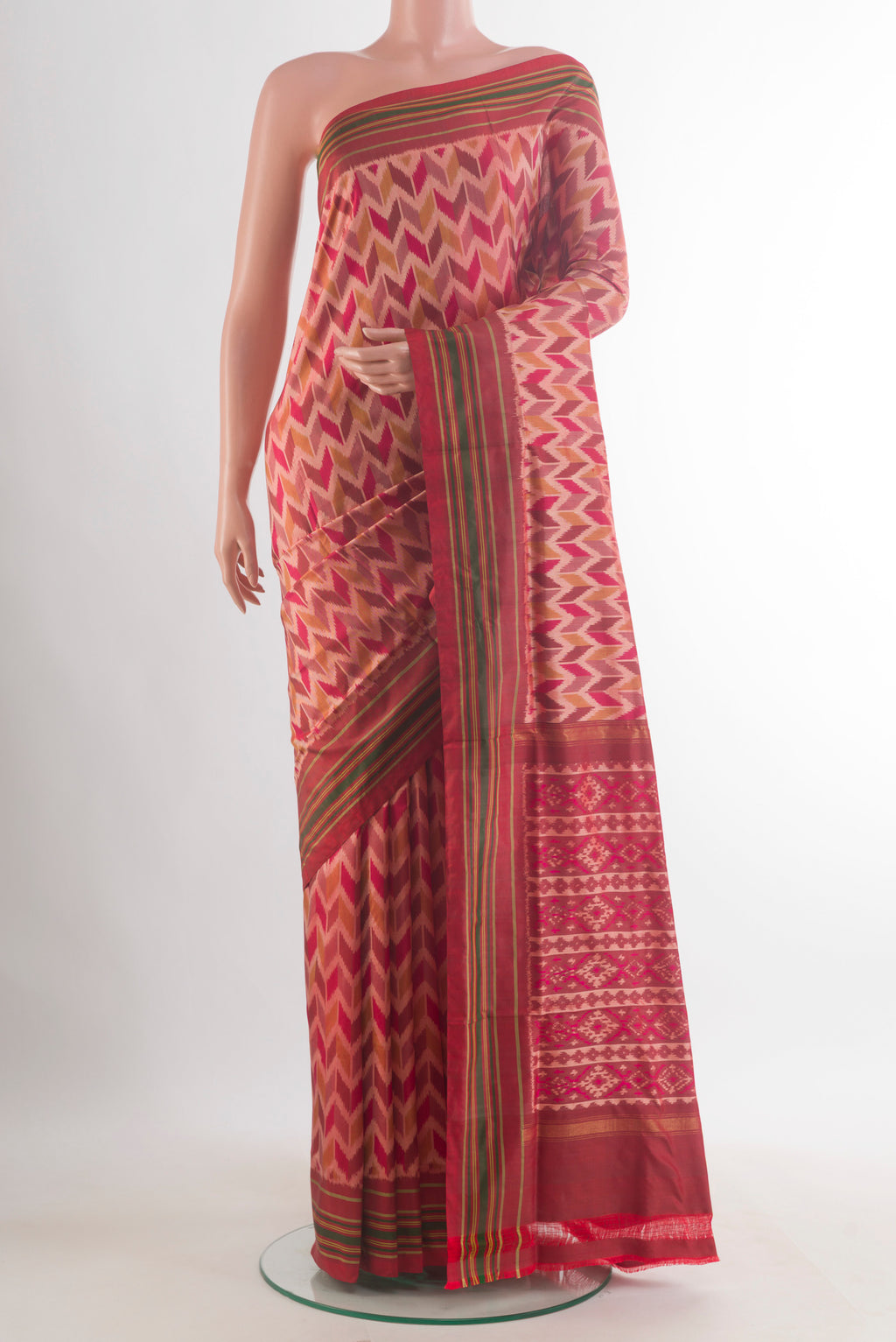 Pure Silk Peach Pochampally Saree with Pure Ikat on the body and Plain Border.  displayed on a mannequin