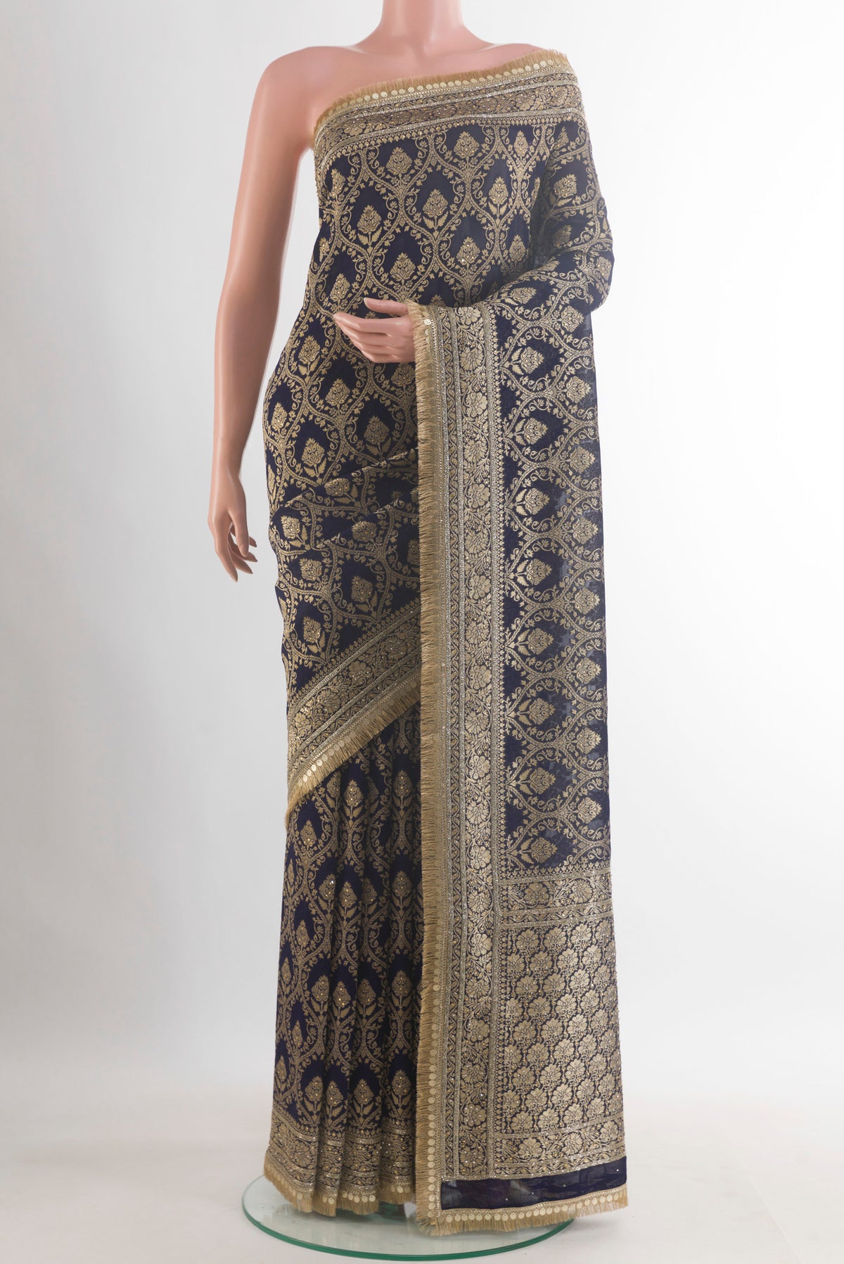 Navy Blue Blended Banarasi Georgette Saree with Zari Brocade on the body and Zari Border.  displayed on a mannequin
