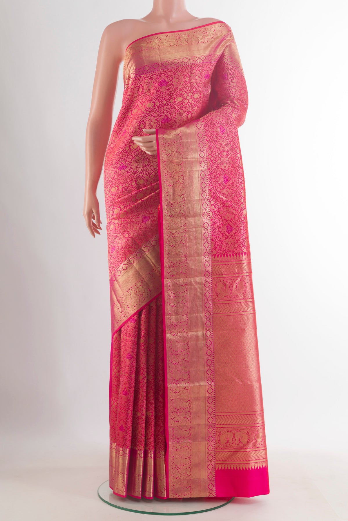 Pure Silk Pink Kanchipuram Saree with Zari Brocade on the body and Zari Border.  displayed on a mannequin