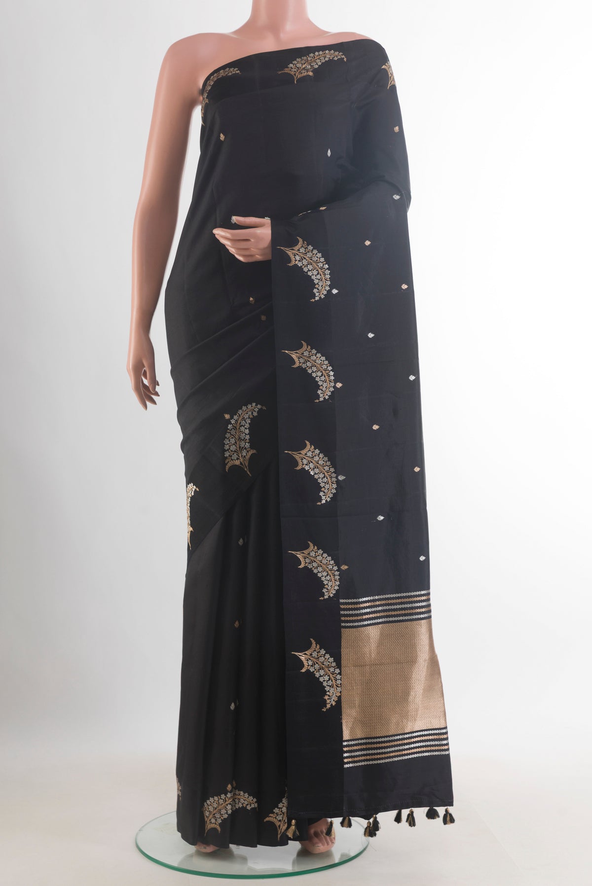 Pure Silk Black Banarasi Saree with Zari Butta on the body and Zari Border.  displayed on a mannequin