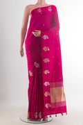 Pure Silk Pink Banarasi Katan Saree with Zari Butta on the body and Zari Border.  displayed on a mannequin