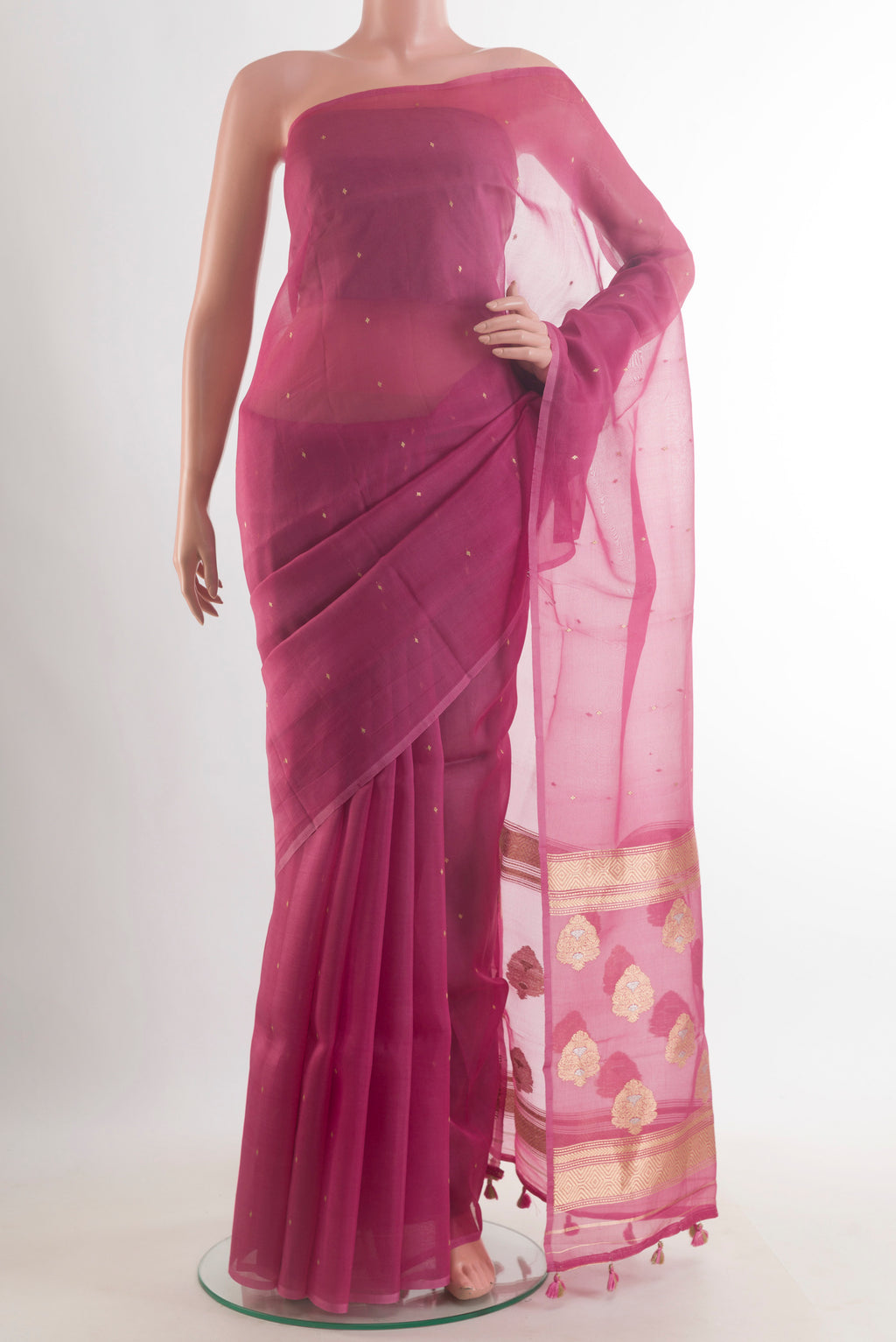 Pink Organza Saree with Zari Butta on the body and Without Border.  displayed on a mannequin