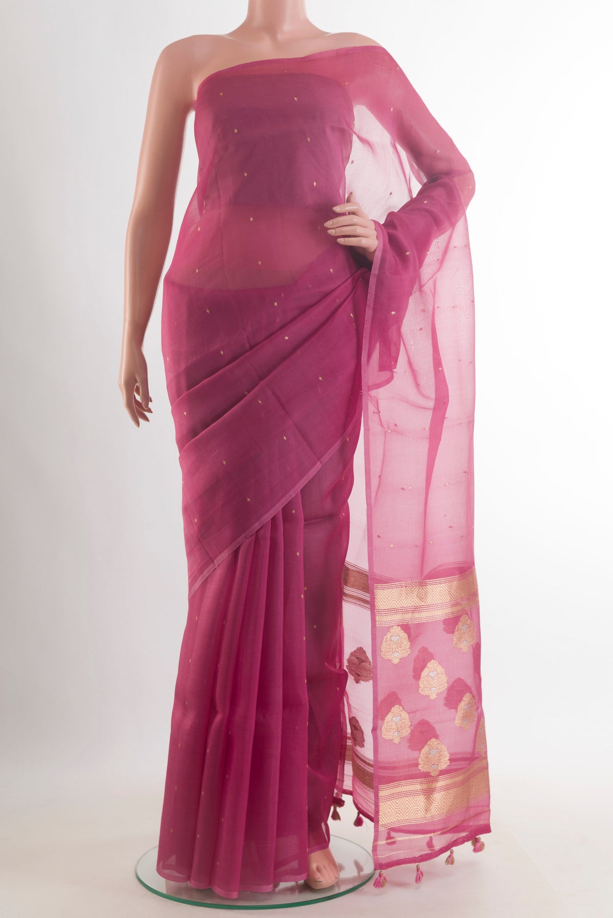 Pink Organza Saree with Zari Butta on the body and Without Border.  displayed on a mannequin