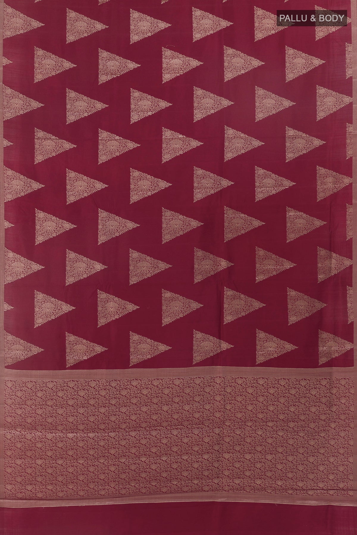 Flat view of Maroon Tussar Saree with Zari Butta on the body and Zari Border. 