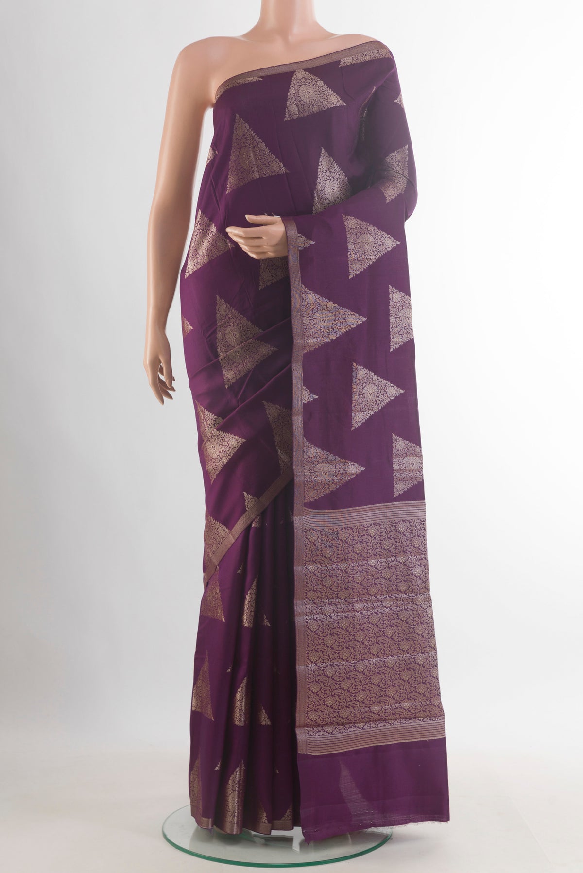 Purple Tussar Saree with Zari Butta on the body and Zari Border.  displayed on a mannequin