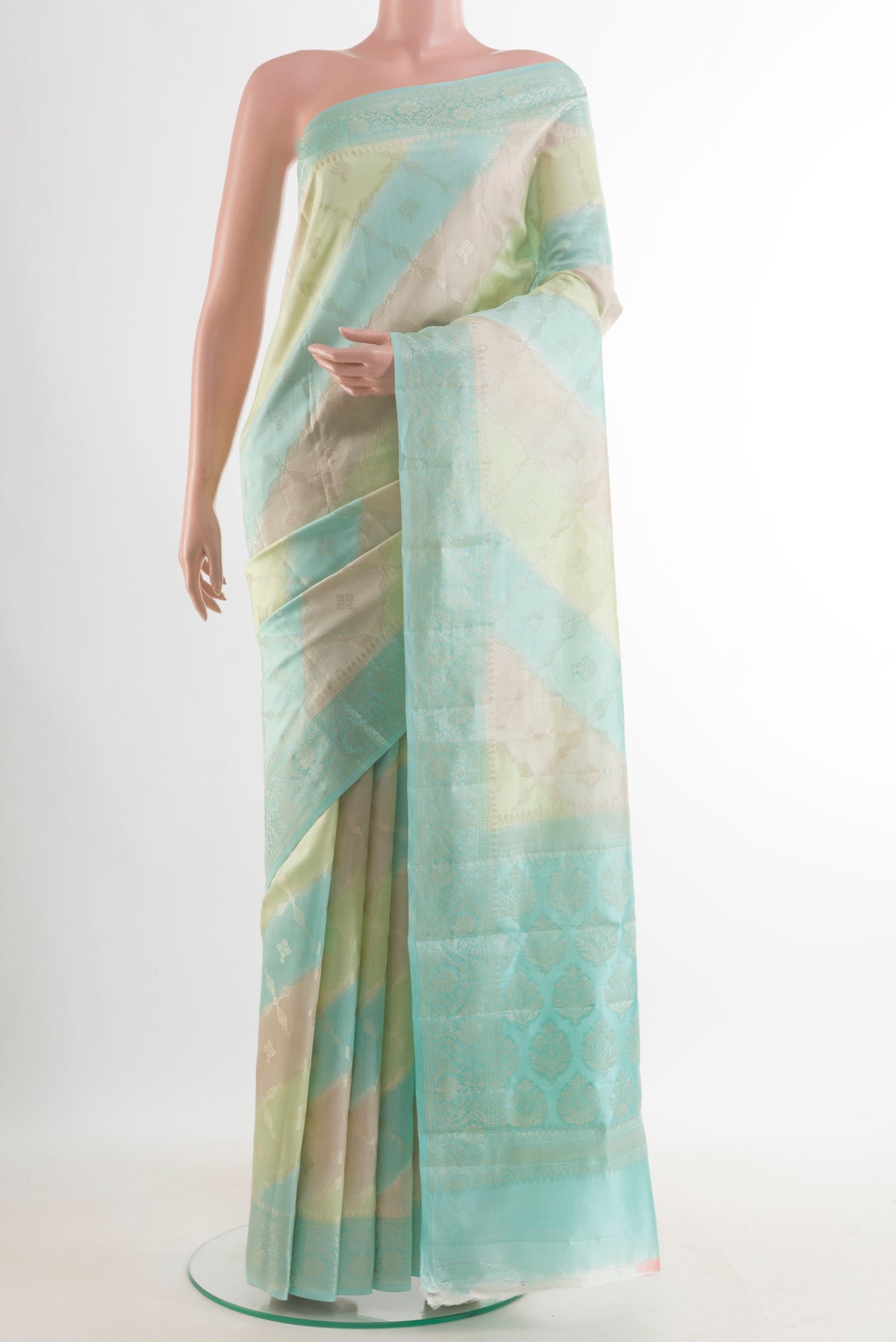 Multi Color Tussar Saree with Zari Brocade on the body and Zari Border.  displayed on a mannequin