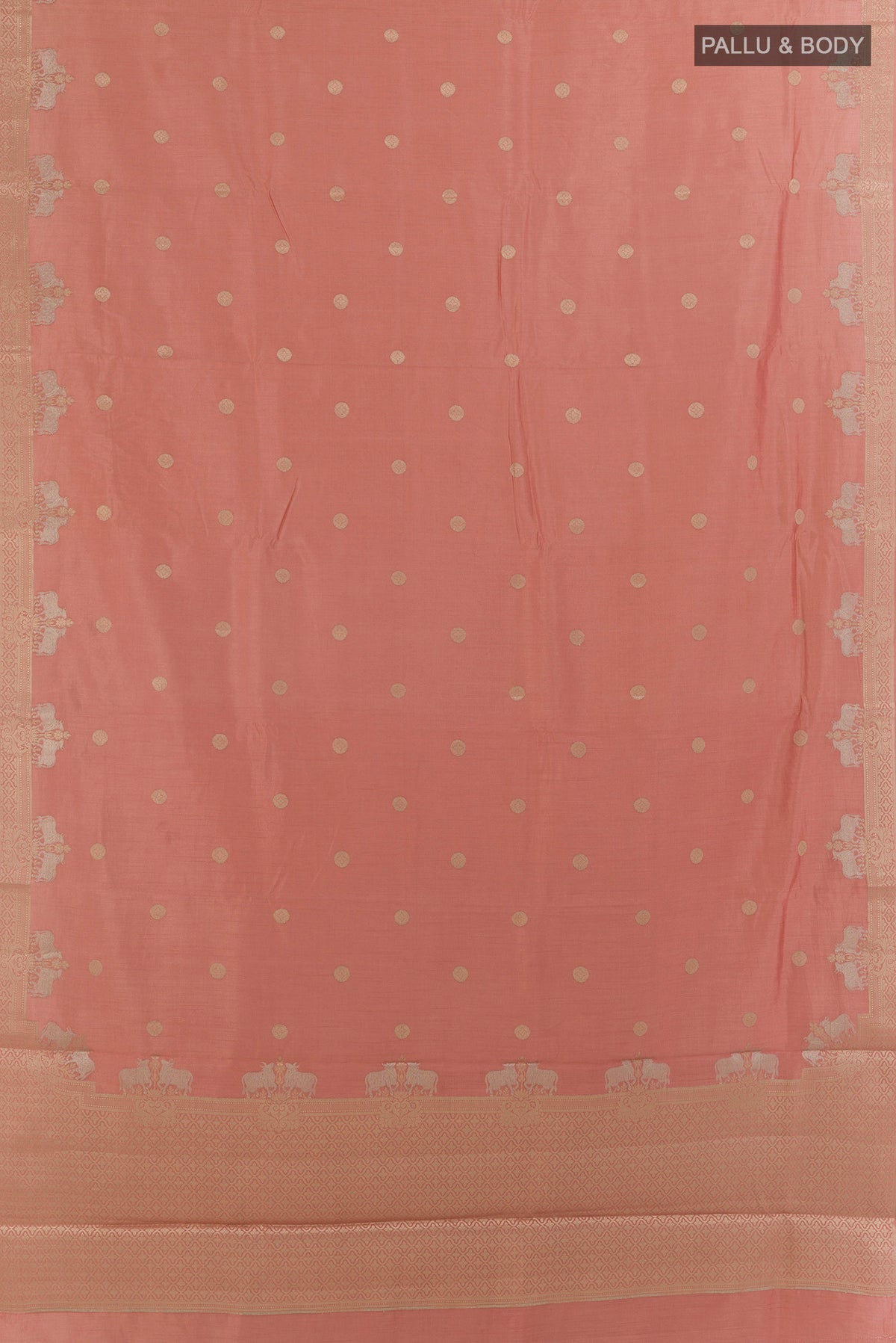Flat view of Peach Tussar Saree with Zari Butta on the body and Zari Border. 
