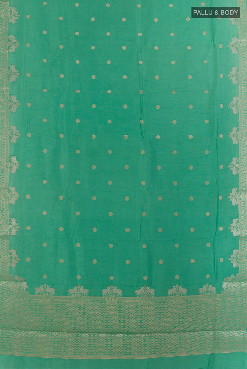 Flat view of Green Tussar Saree with Zari Butta on the body and Zari Border. 