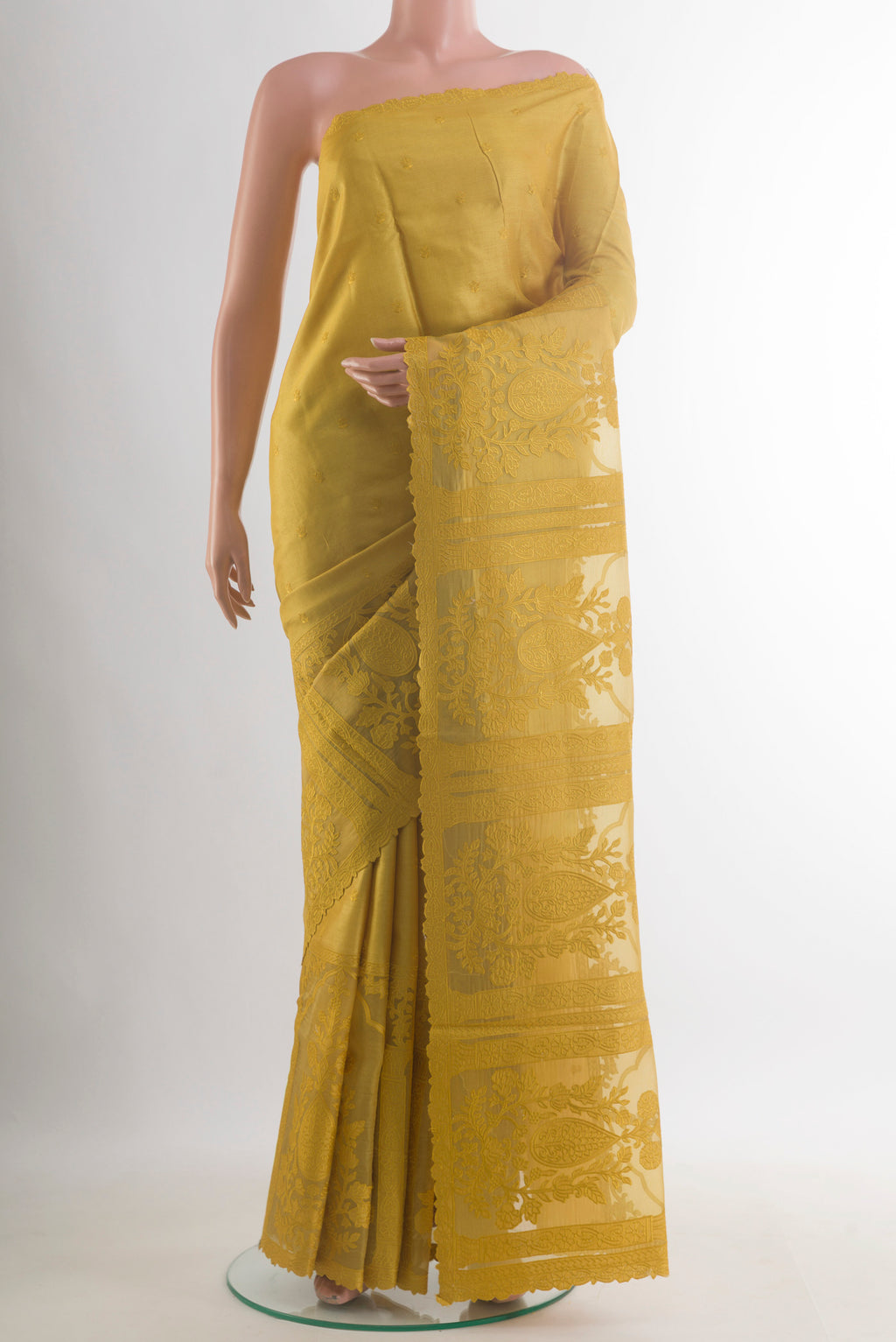 Mustard Tussar Saree with Embroidered on the body and Embroidered Border.  displayed on a mannequin