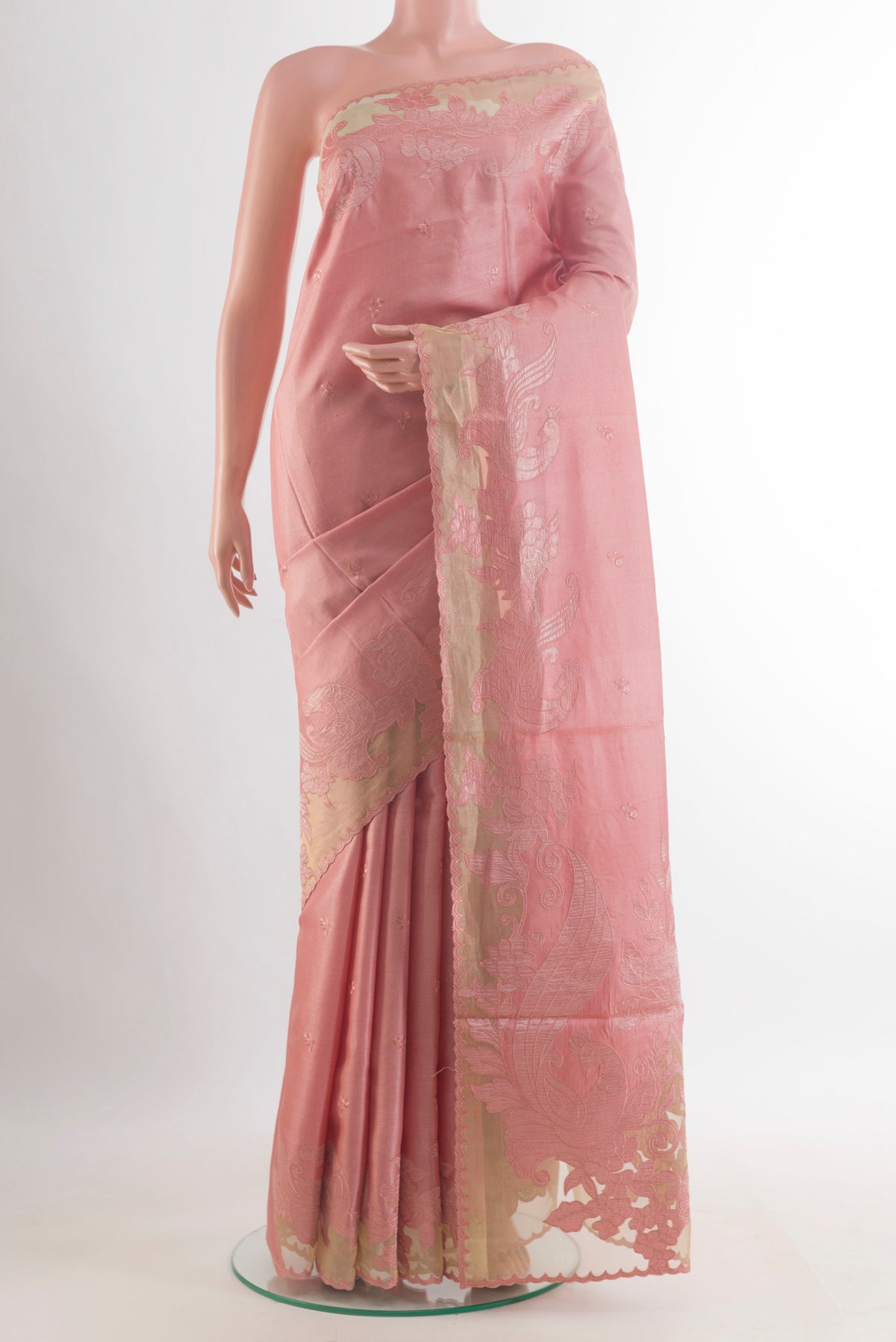 Peach Tussar Saree with Embroidered on the body and Embroidered Border.  displayed on a mannequin