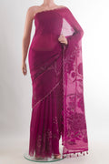 Magenta Organza Saree with Embroidered on the body and Embroidered Border.  displayed on a mannequin