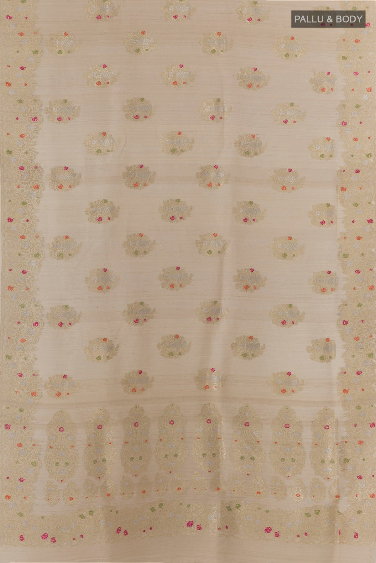 Flat view of Off White Banarasi Tussar Saree with Zari Butta on the body and Zari Border. 