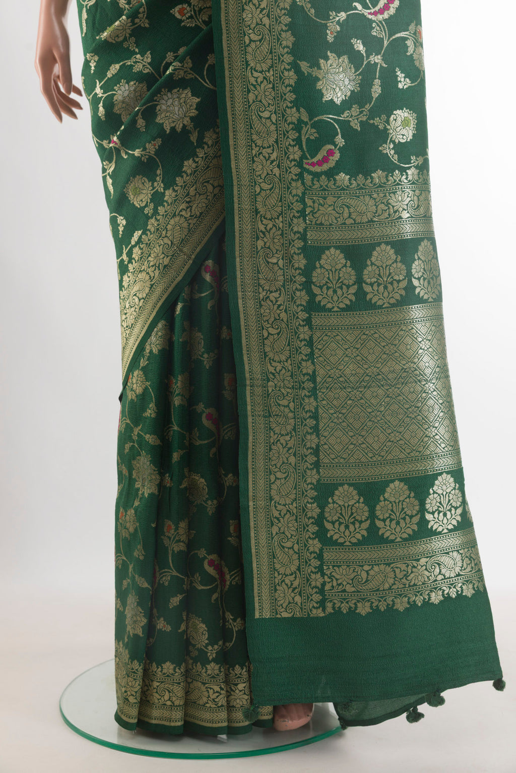 Pleats and pallu of Bottle Green Banarasi Tussar Saree with Zari Brocade on the body and Zari Border. 