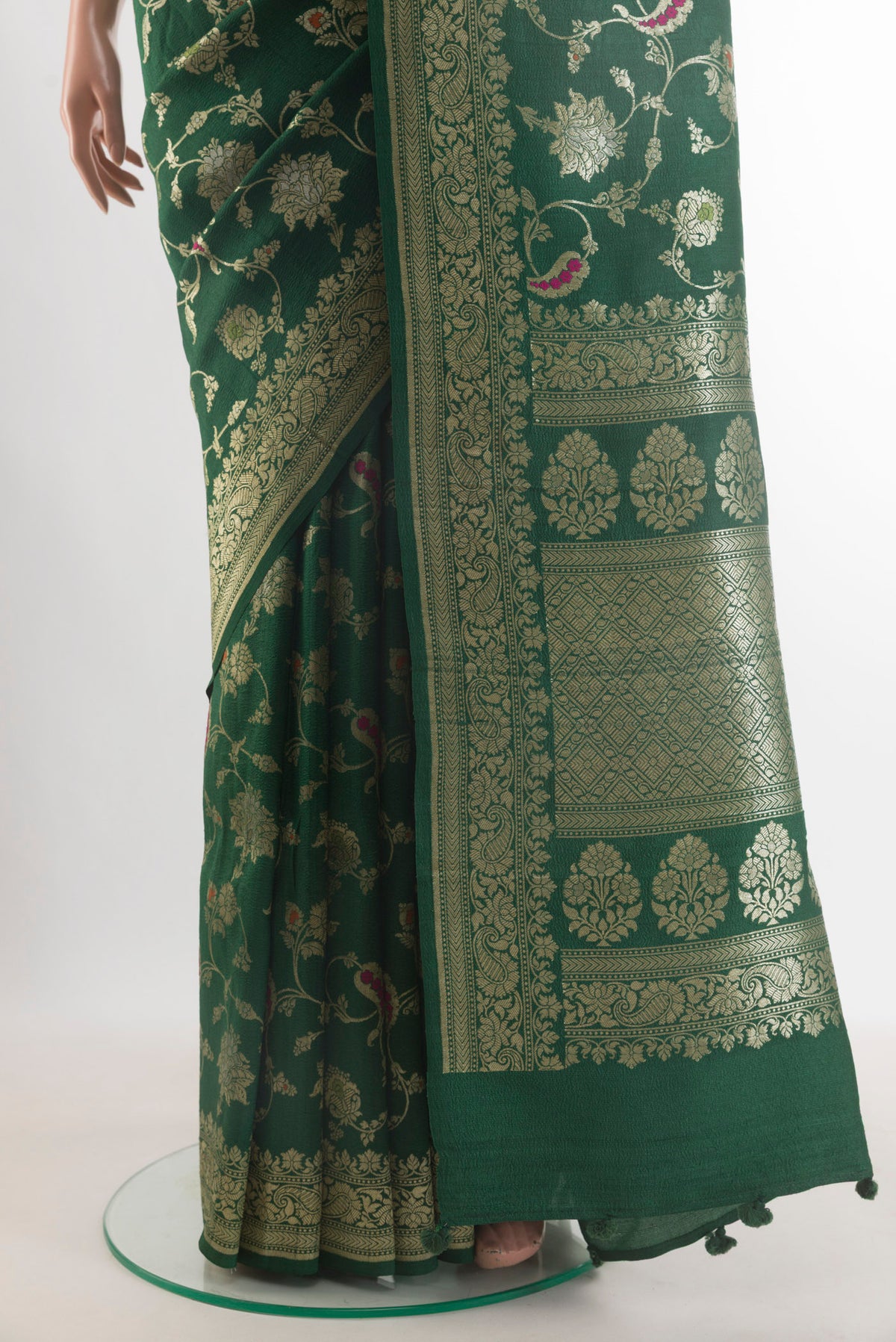 Pleats and pallu of Bottle Green Banarasi Tussar Saree with Zari Brocade on the body and Zari Border. 