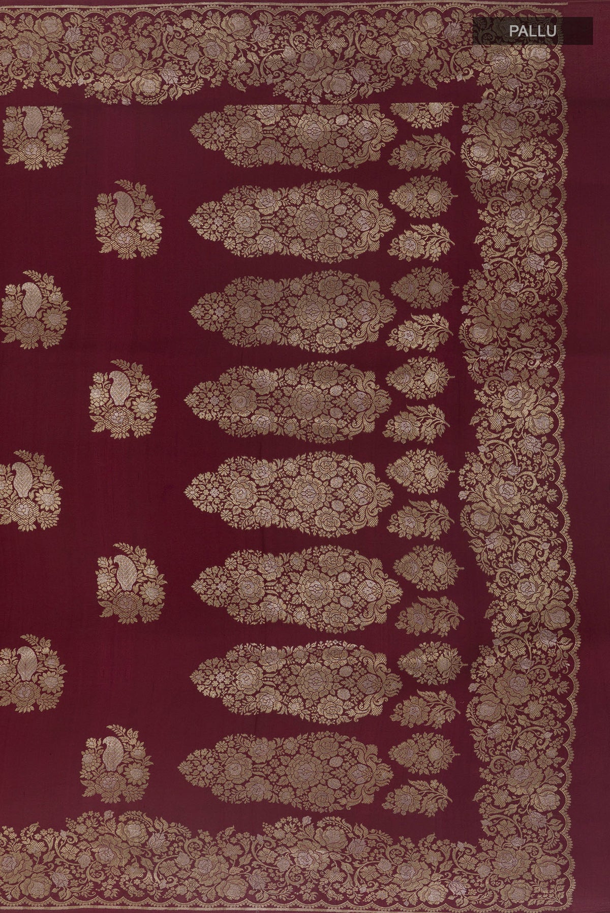 Close up image of the pallu of Maroon Banarasi Tussar Saree with Zari Butta on the body and Zari Border. 