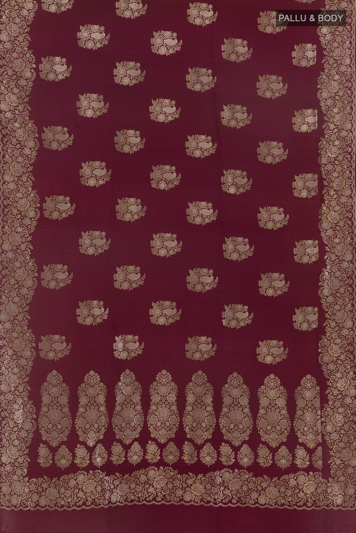 Flat view of Maroon Banarasi Tussar Saree with Zari Butta on the body and Zari Border. 