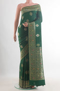 Green Banarasi Tussar Saree with Zari Butta on the body and Zari Border.  displayed on a mannequin