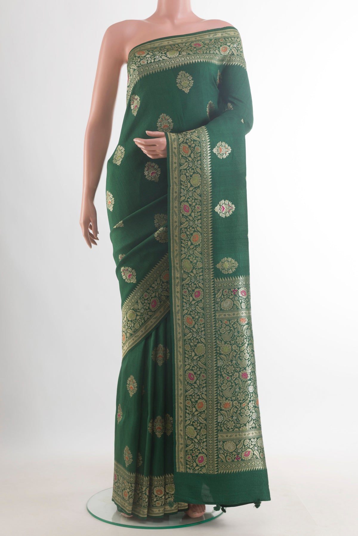 Green Banarasi Tussar Saree with Zari Butta on the body and Zari Border.  displayed on a mannequin