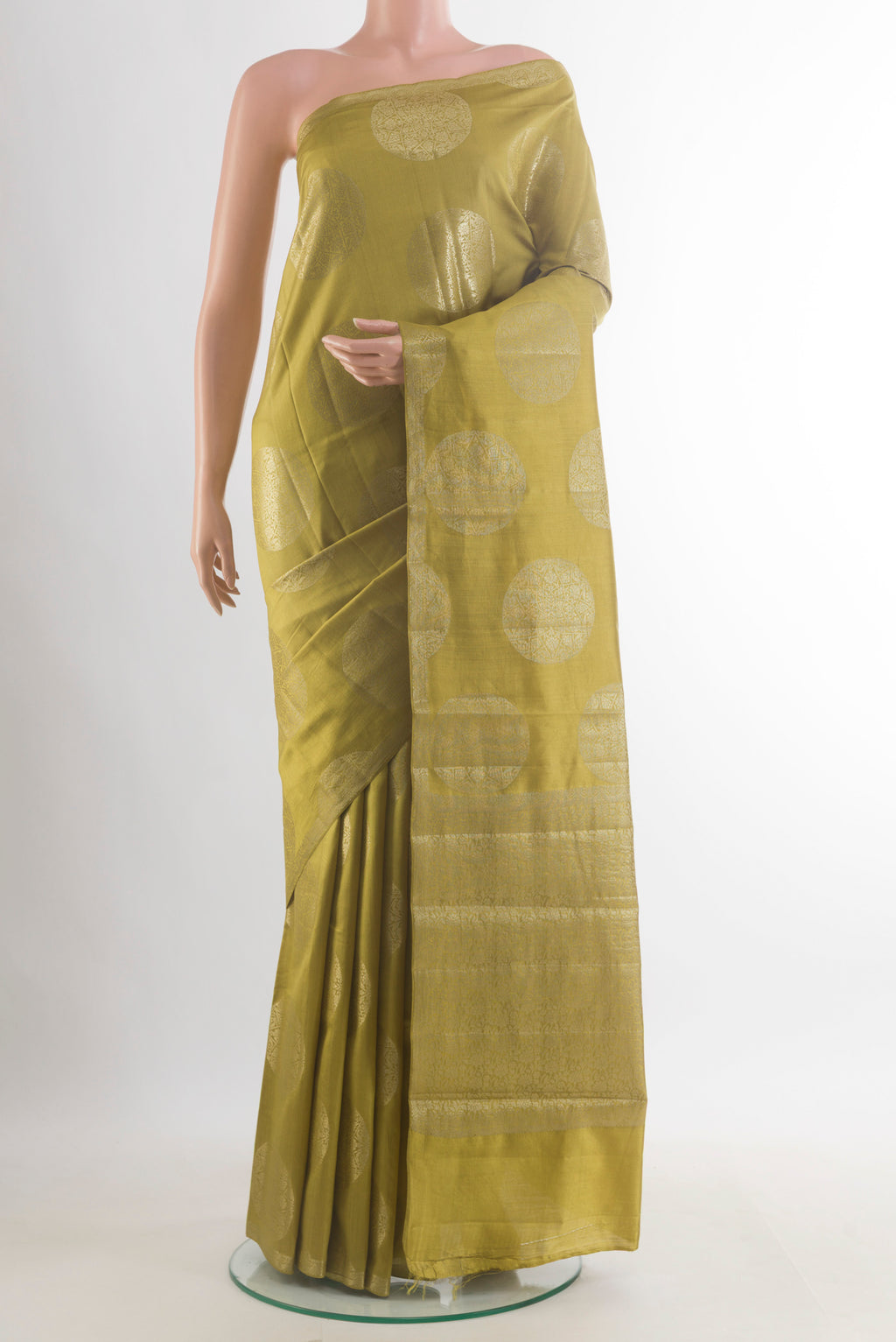 Mehandi Green Tussar Saree with Zari Butta on the body and Zari Border.  displayed on a mannequin