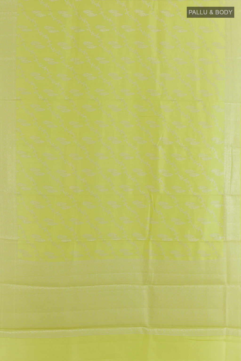Flat view of Light Green Tussar Saree with Zari Brocade on the body and Zari Border. 