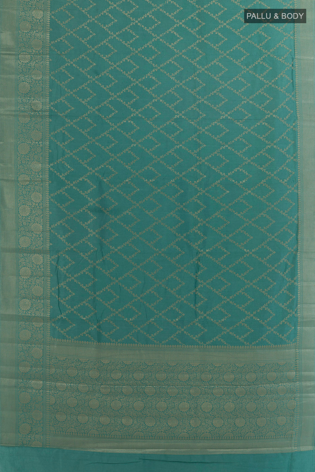 Flat view of Turquoise Tussar Saree with Zari Brocade on the body and Zari Border. 