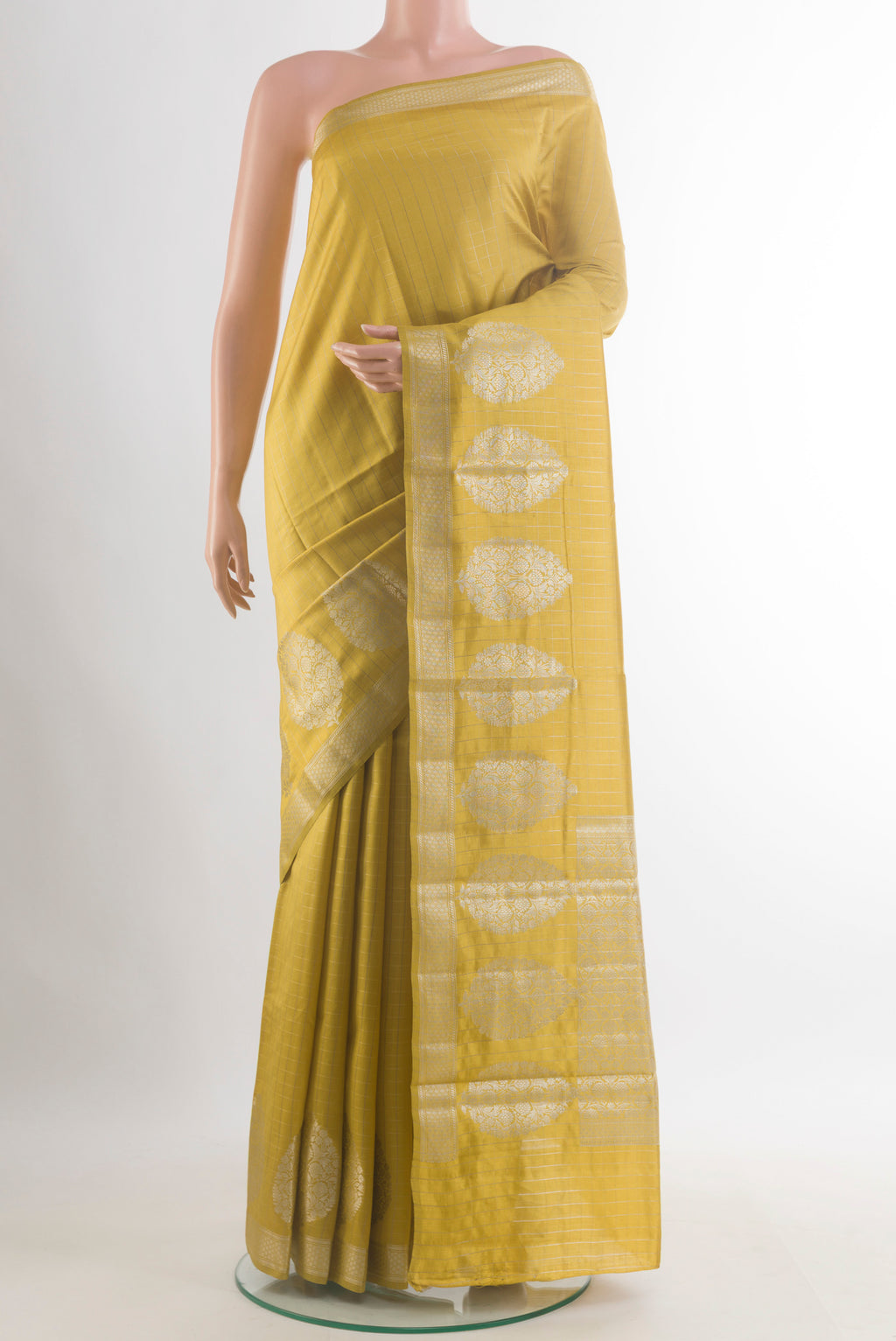 Mustard Tussar Saree with Checked design on the body and Zari Border.  displayed on a mannequin
