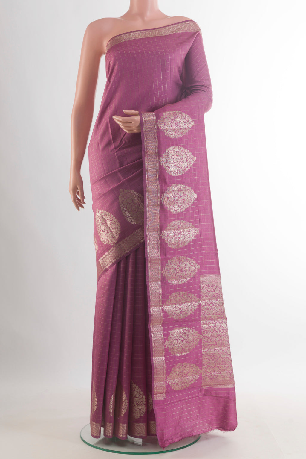 Mauve Tussar Saree with Checked design on the body and Zari Border.  displayed on a mannequin