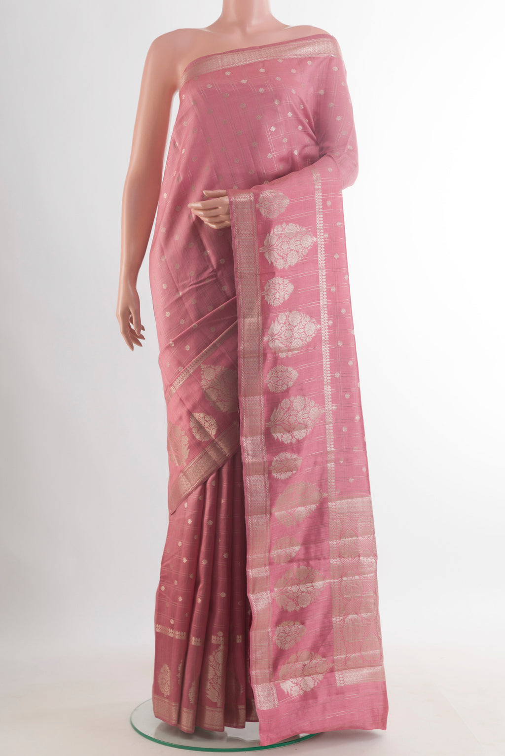 Rose Gold Tussar Saree with Checked design on the body and Zari Border.  displayed on a mannequin