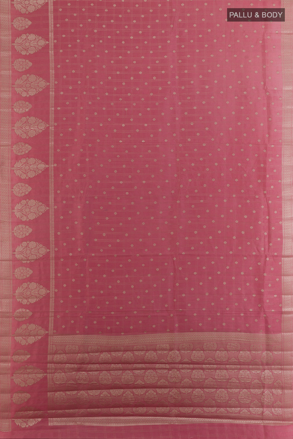 Flat view of Rose Gold Tussar Saree with Checked design on the body and Zari Border. 