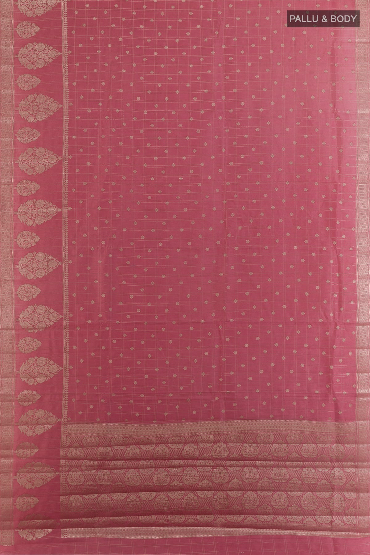 Flat view of Rose Gold Tussar Saree with Checked design on the body and Zari Border. 