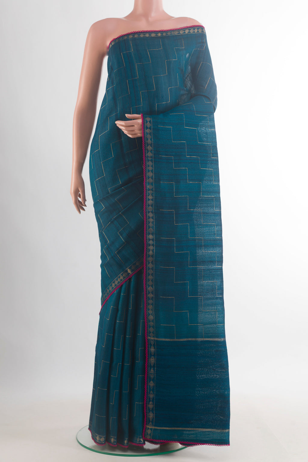 Blue Tussar Saree with Zig Zag design on the body and Zari Border.  displayed on a mannequin
