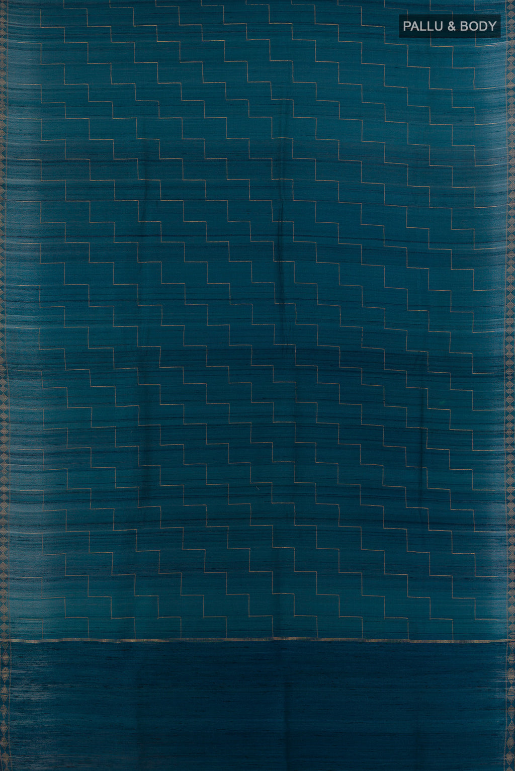 Flat view of Blue Tussar Saree with Zig Zag design on the body and Zari Border. 