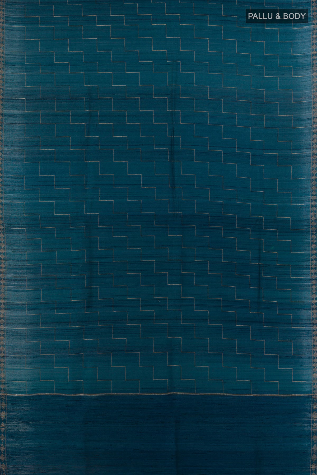 Flat view of Blue Tussar Saree with Zig Zag design on the body and Zari Border. 