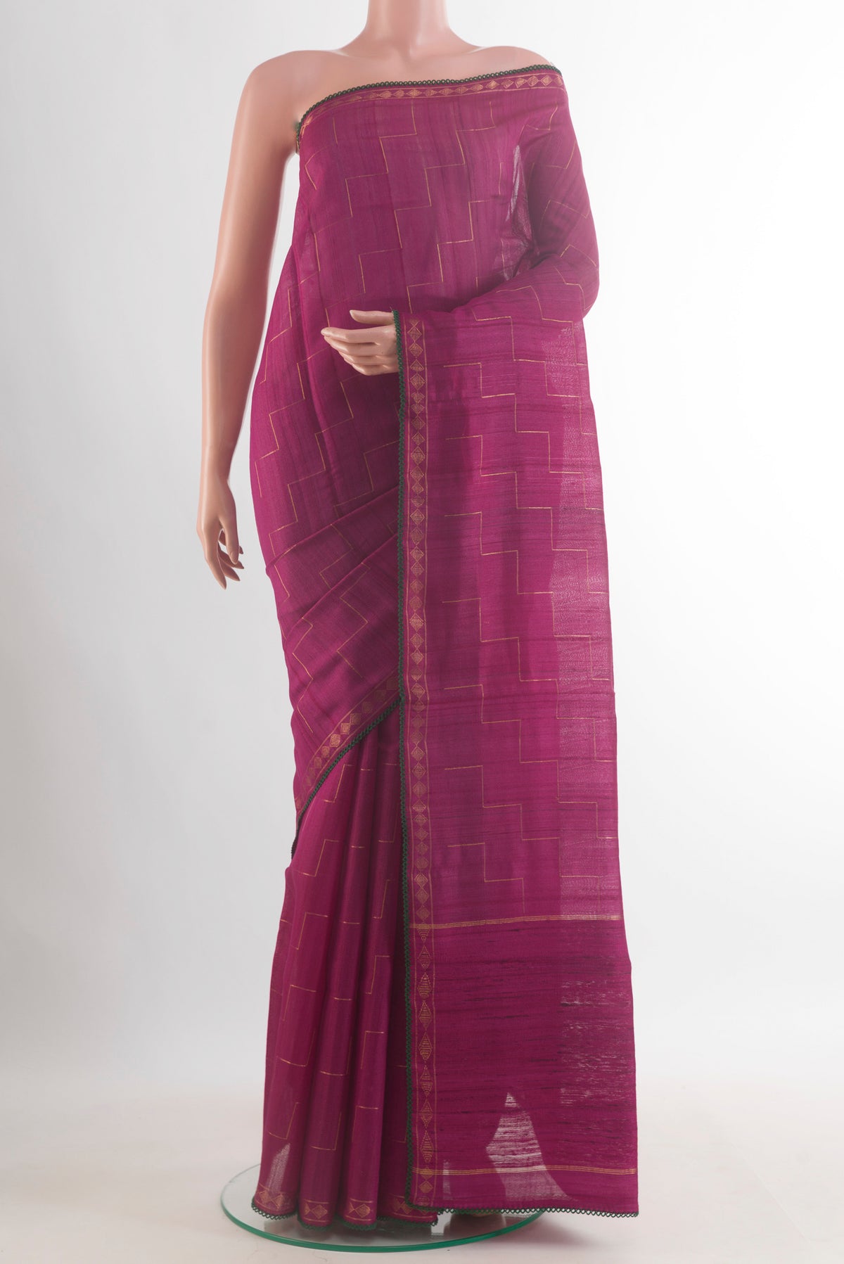 Dark Pink Tussar Saree with Zig Zag design on the body and Zari Border.  displayed on a mannequin