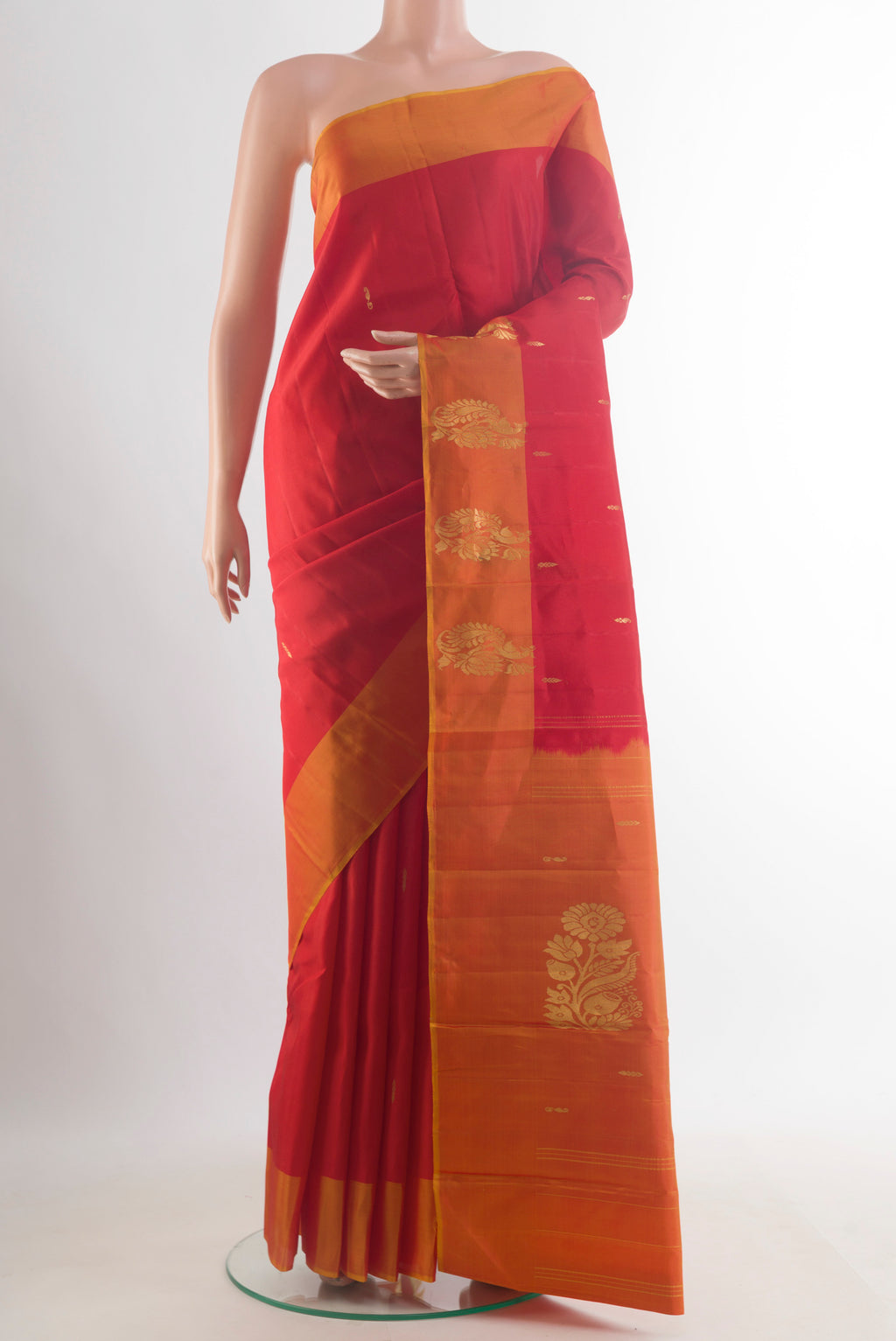 Pure Silk Red Kanchipuram Saree with Zari Butta on the body and Zari Border.  displayed on a mannequin