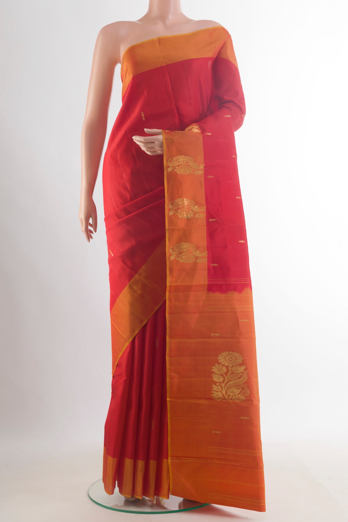 Pure Silk Red Kanchipuram Saree with Zari Butta on the body and Zari Border.  displayed on a mannequin