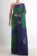 Pure Silk Green Kanchipuram Saree with Zari Butta on the body and Zari Border.  displayed on a mannequin