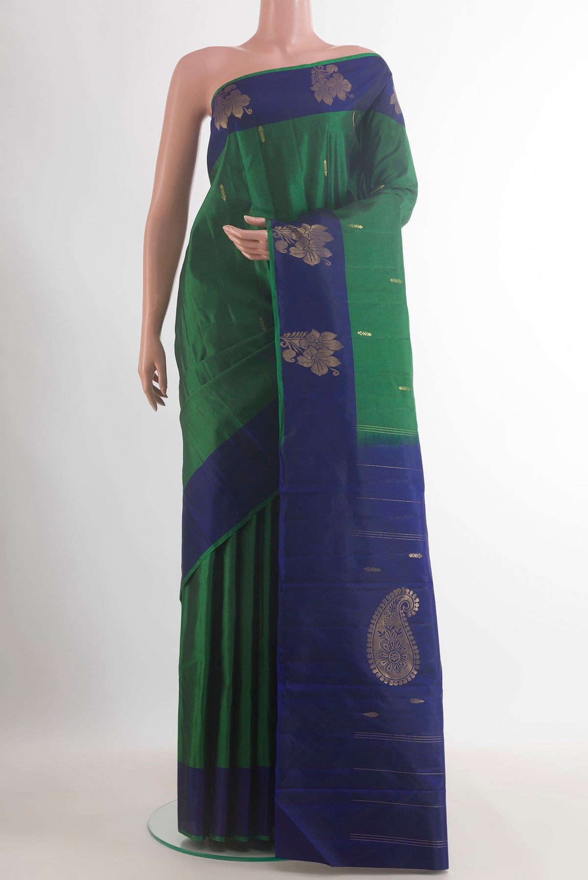 Pure Silk Green Kanchipuram Saree with Zari Butta on the body and Zari Border.  displayed on a mannequin