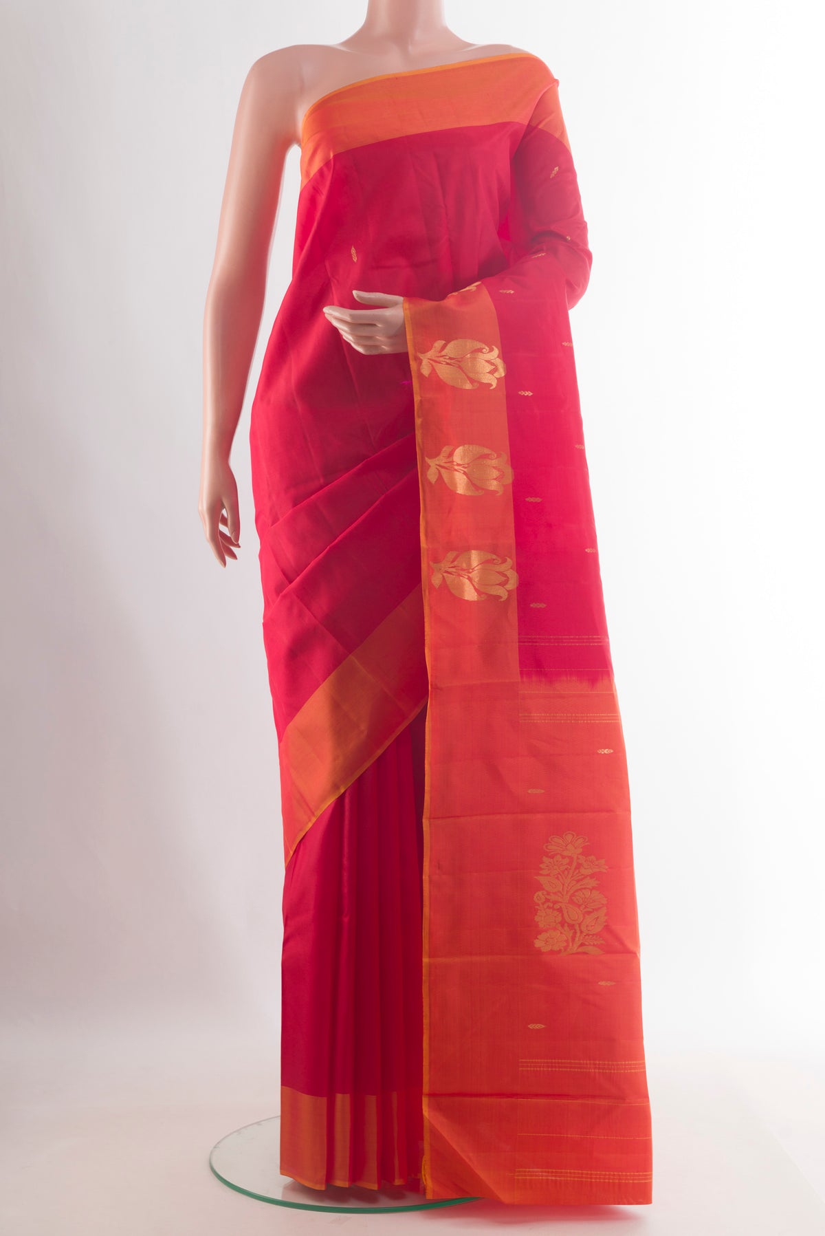 Pure Silk Red Kanchipuram Saree with Zari Butta on the body and Zari Border.  displayed on a mannequin