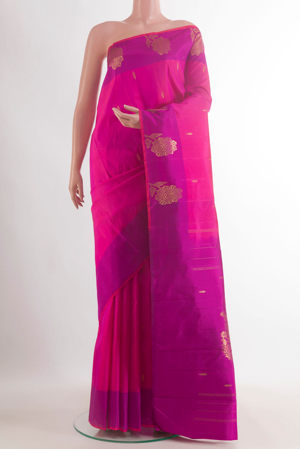 Pure Silk Pink Kanchipuram Saree with Zari Butta on the body and Zari Border.  displayed on a mannequin
