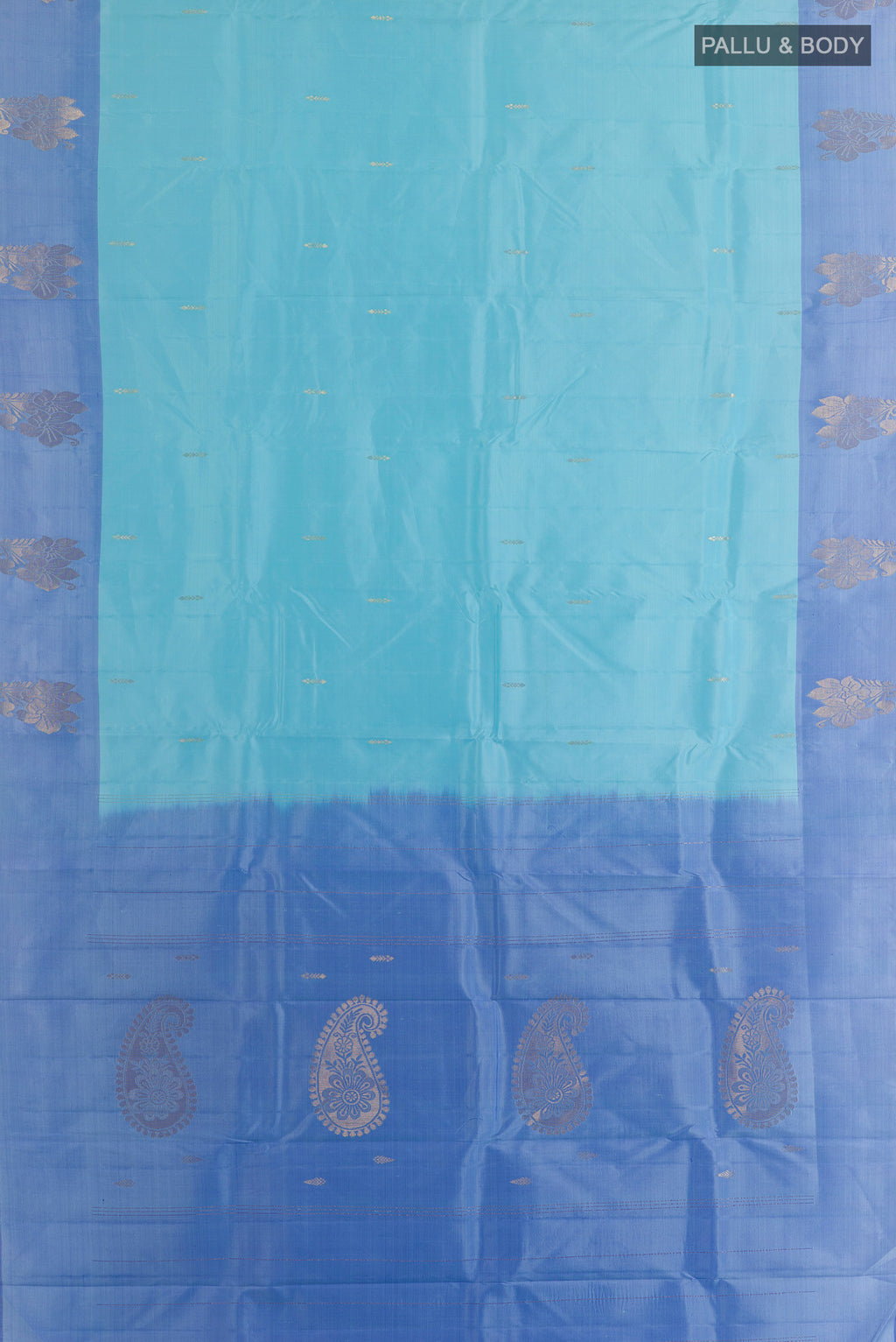 Flat view of Pure Silk Light Blue Kanchipuram Saree with Zari Butta on the body and Zari Border. 